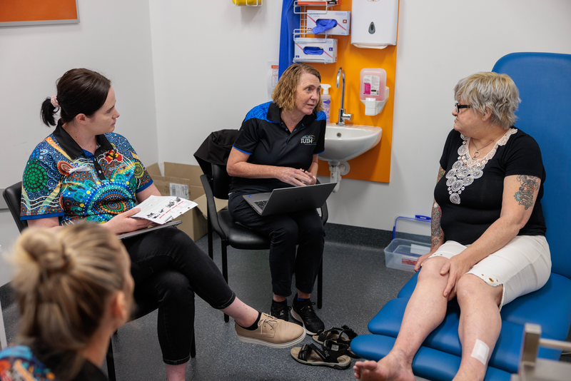 Image of a client and MATSICHS staff discussing diabetes education