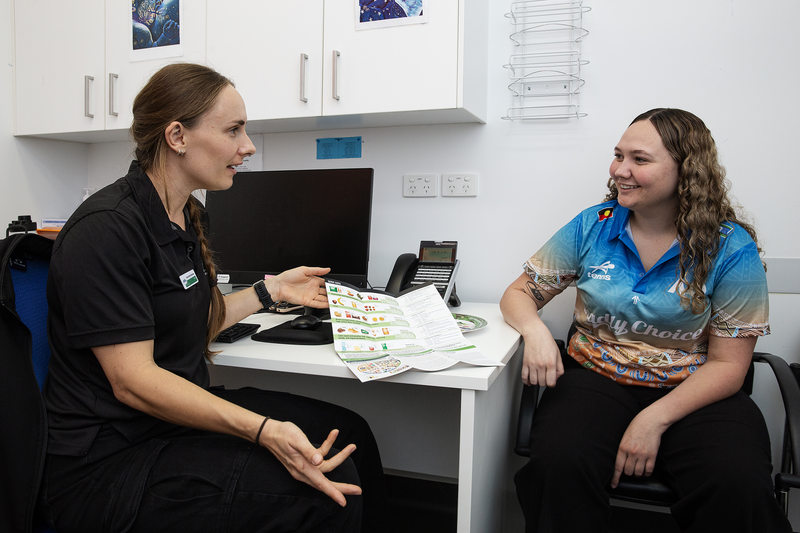 Image of client and MATSICHS staff discussing diet and nutrition