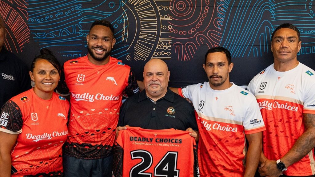Group photo of people wearing Deadly Choices shirts on a contact us page.