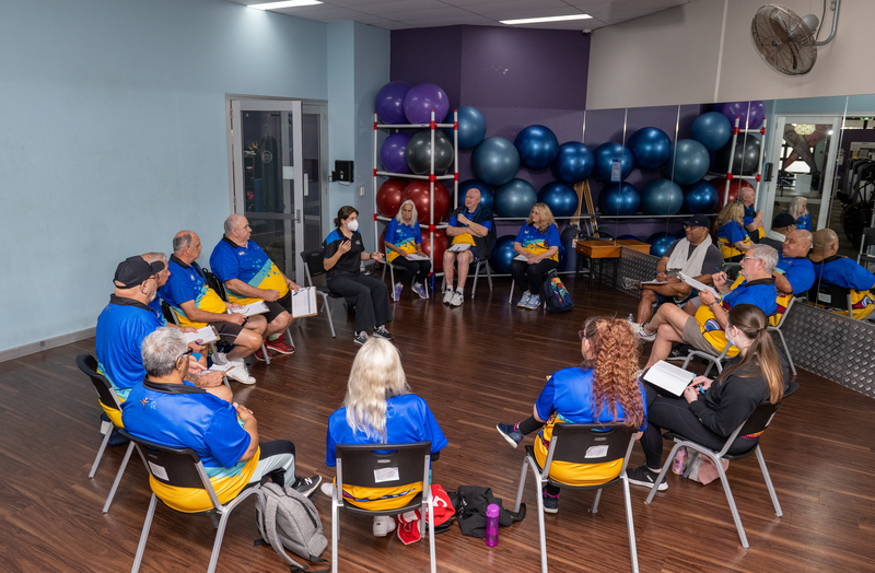 Exercise rehab for Mob, Work It Out program, client group having a yarn.