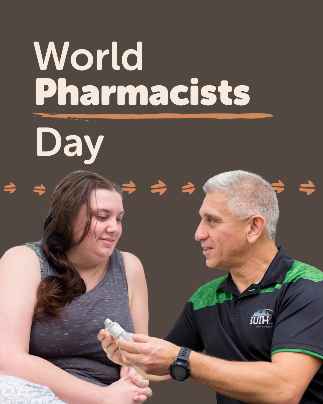 Aboriginal and Torres Strait Islander pharmacist smiling to a patient and showing her a medical device in a clinical setting, celebrating World Pharmacist Day.